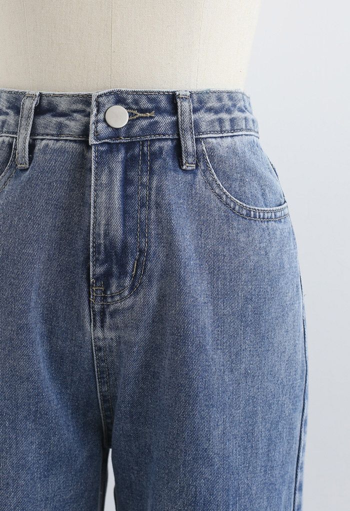 بنطال جينز بخصر مرتفع بأساور مشقوقة باللون الأزرق